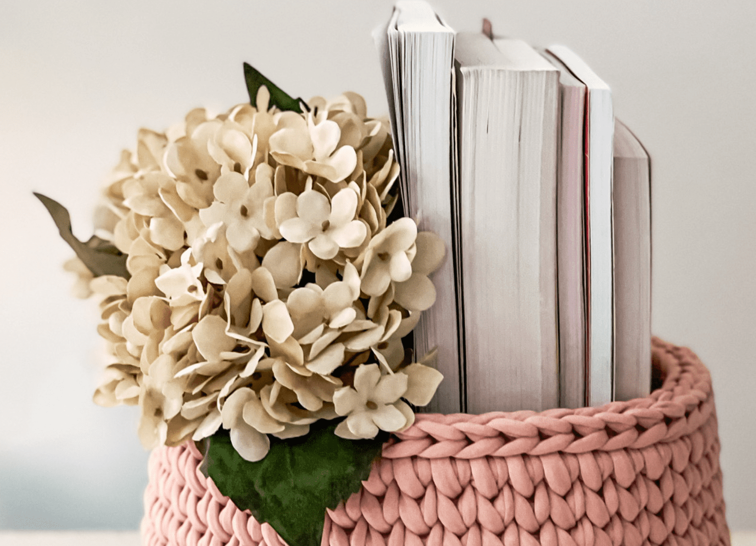 Pink basket with books